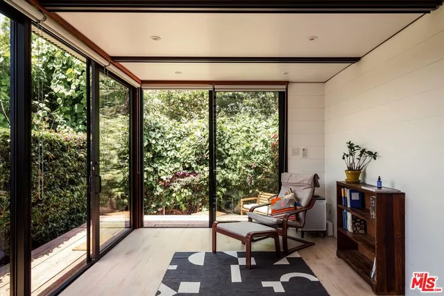 a view of a balcony with chairs