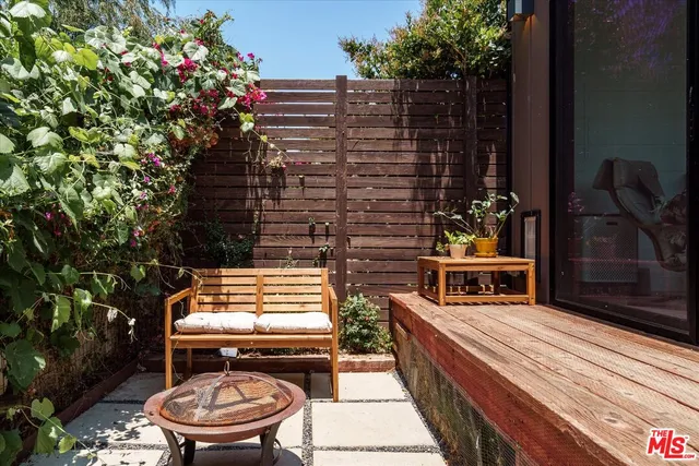 a view of a livingroom with furniture and a window
