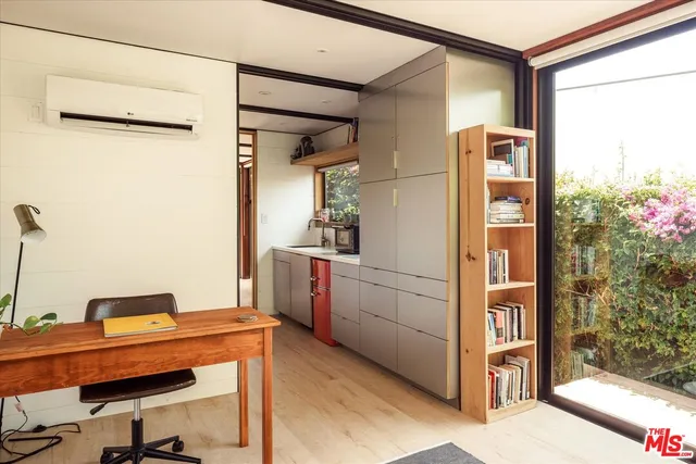 a kitchen with a sink and a refrigerator