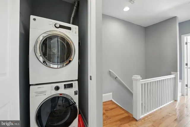 a view of a hallway with washer and dryer