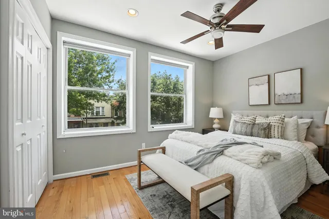 a bedroom with a bed and a window