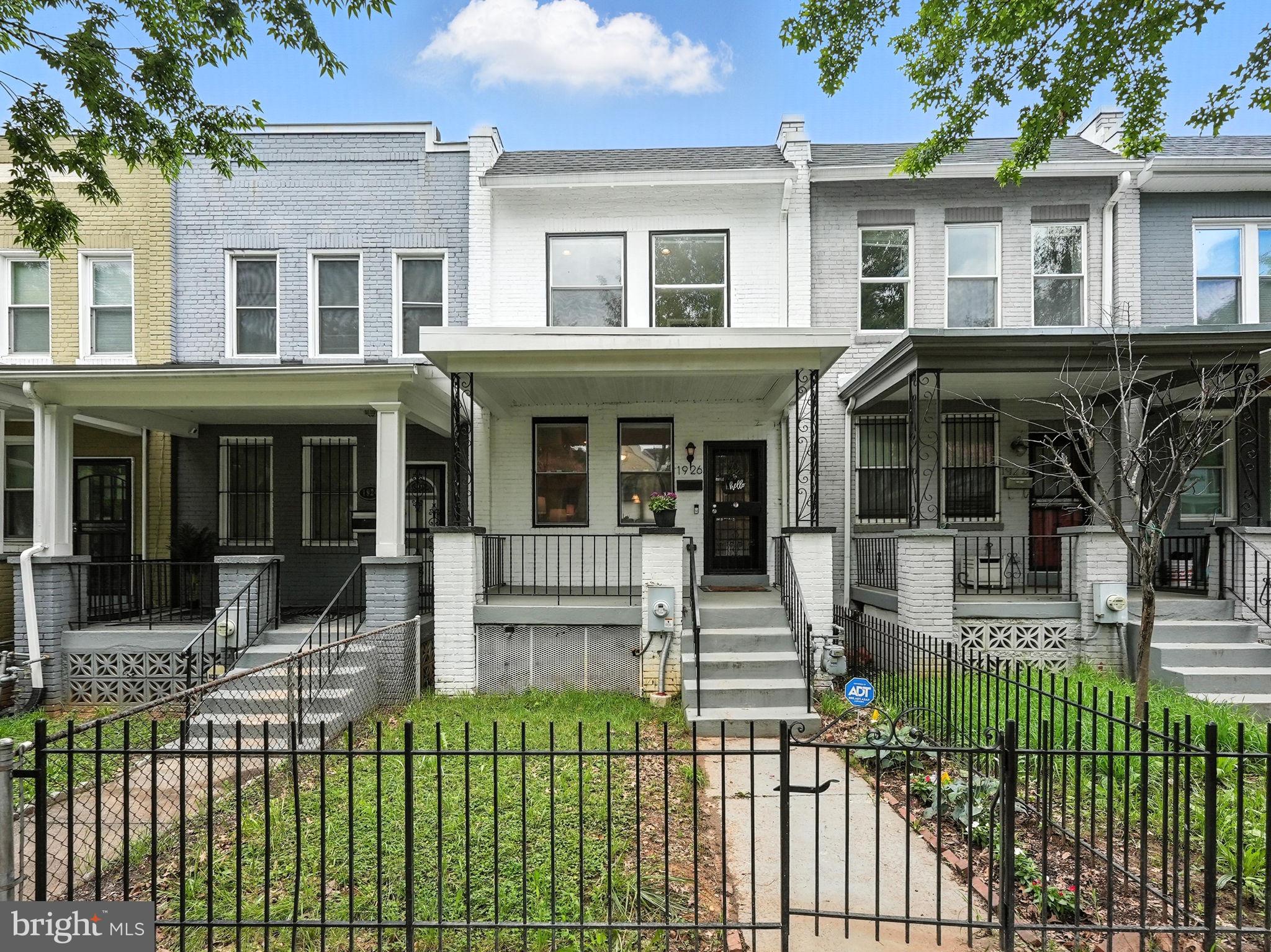 1926 Bennett Place Northeast Washington, DC 20002 - Photo 2 of 38 front view of a house with a yard