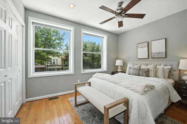 a bedroom with a bed and a table