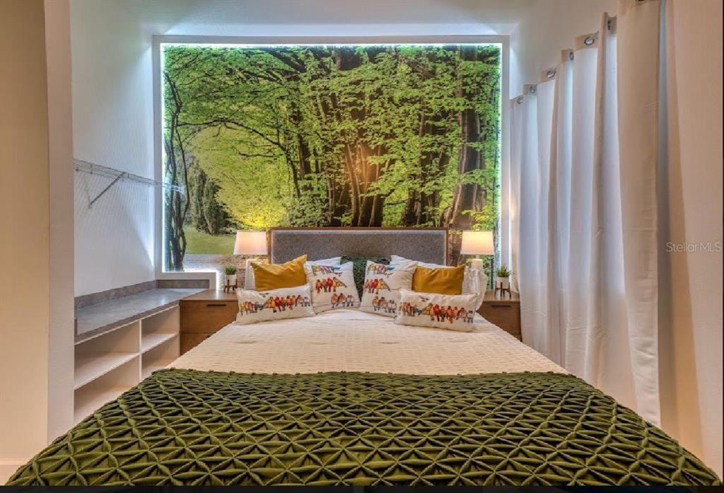 6301 Sand Skipper Road Orlando, FL 32821 - Photo 25 of 80 a bedroom with a bed and wooden floor