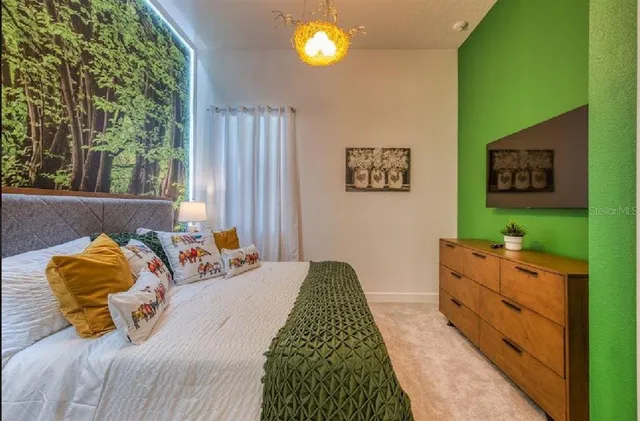 a spacious bathroom with a double vanity sink and a mirror