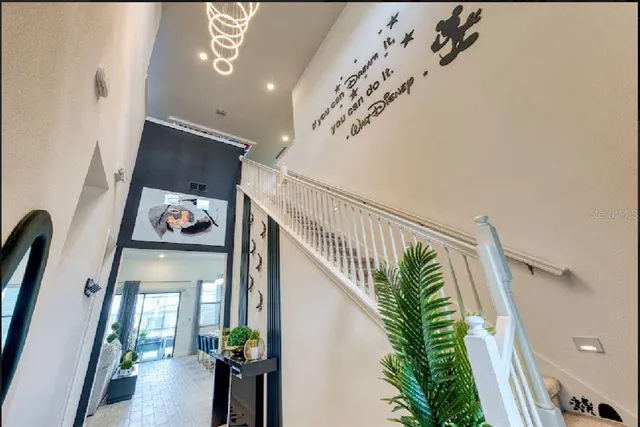 a view of entryway and hall with a front door