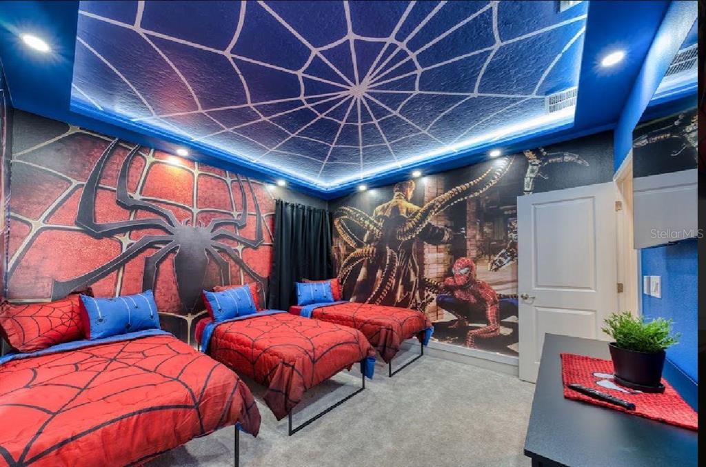 6301 Sand Skipper Road Orlando, FL 32821 - Photo 46 of 80 a bed room with two beds and a potted plant