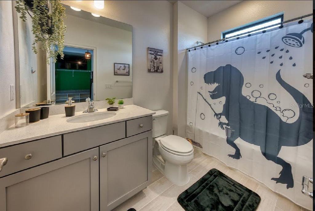 6301 Sand Skipper Road Orlando, FL 32821 - Photo 47 of 80 a bathroom with a sink toilet and mirror