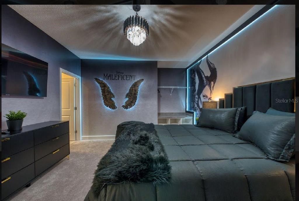 6301 Sand Skipper Road Orlando, FL 32821 - Photo 51 of 80 a living room with furniture and a flat screen tv