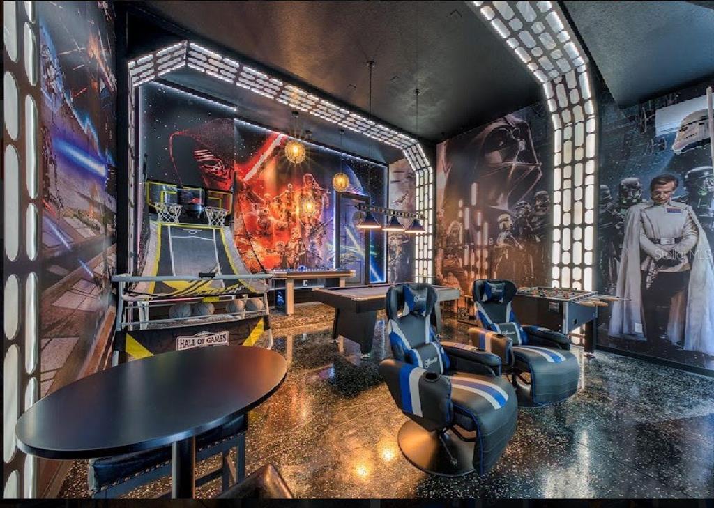 6301 Sand Skipper Road Orlando, FL 32821 - Photo 66 of 80 a room with lots of furniture and a chandelier