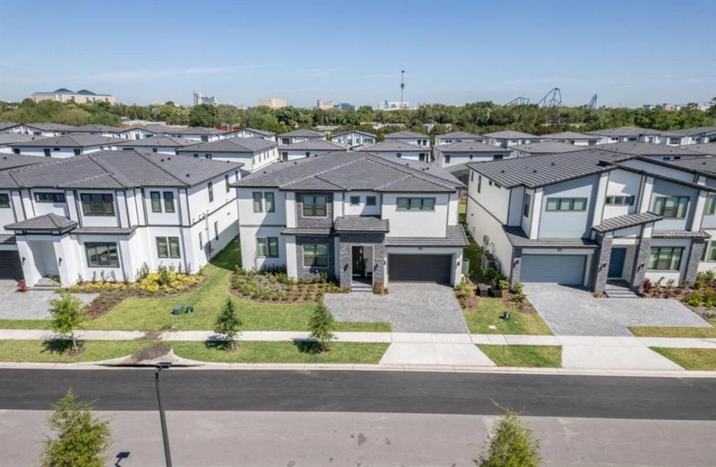 6301 Sand Skipper Road Orlando, FL 32821 - Photo 76 of 80 an aerial view of a house with a garden and plants