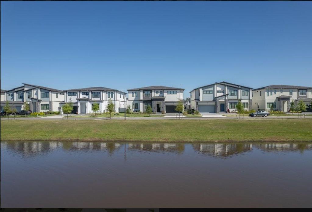 6301 Sand Skipper Road Orlando, FL 32821 - Photo 77 of 80 a view of houses with outdoor space and lake view