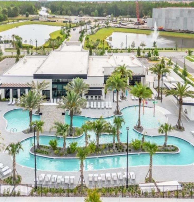 6301 Sand Skipper Road Orlando, FL 32821 - Photo 79 of 80 a view of houses with outdoor space and swimming pool