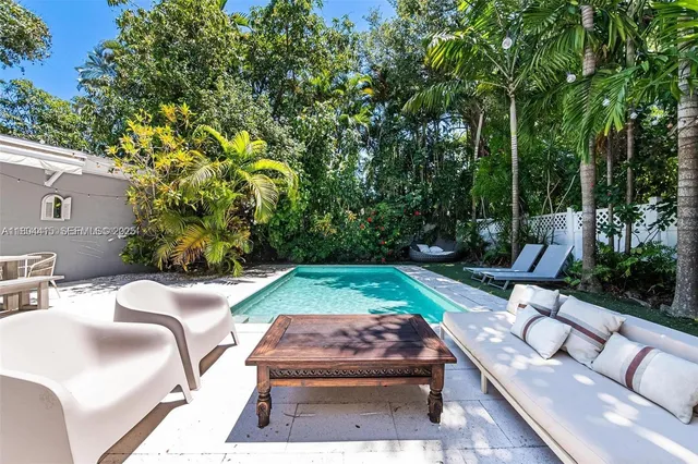a view of backyard with a patio