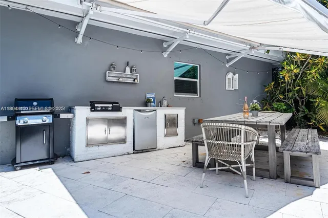 a patio with a table and chairs