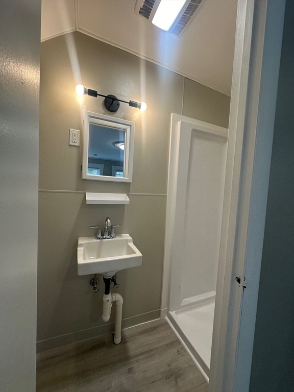 27-29 Allen Street Gardner, MA 01440 - Photo 22 of 30 a bathroom with a sink a mirror and a shower