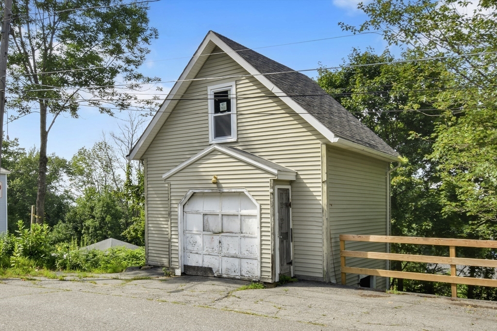 27-29 Allen Street Gardner, MA 01440 - Photo 27 of 30 a front view of a house with a garage