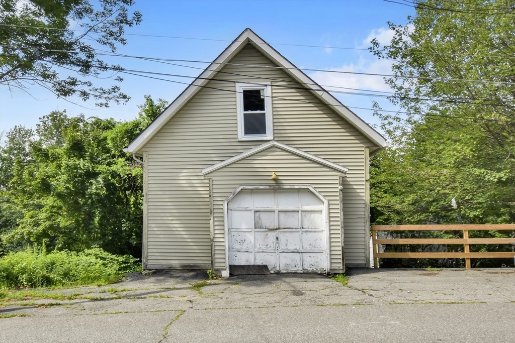 27-29 Allen Street Gardner, MA 01440 - Photo 28 of 30 a front view of a house with a garage