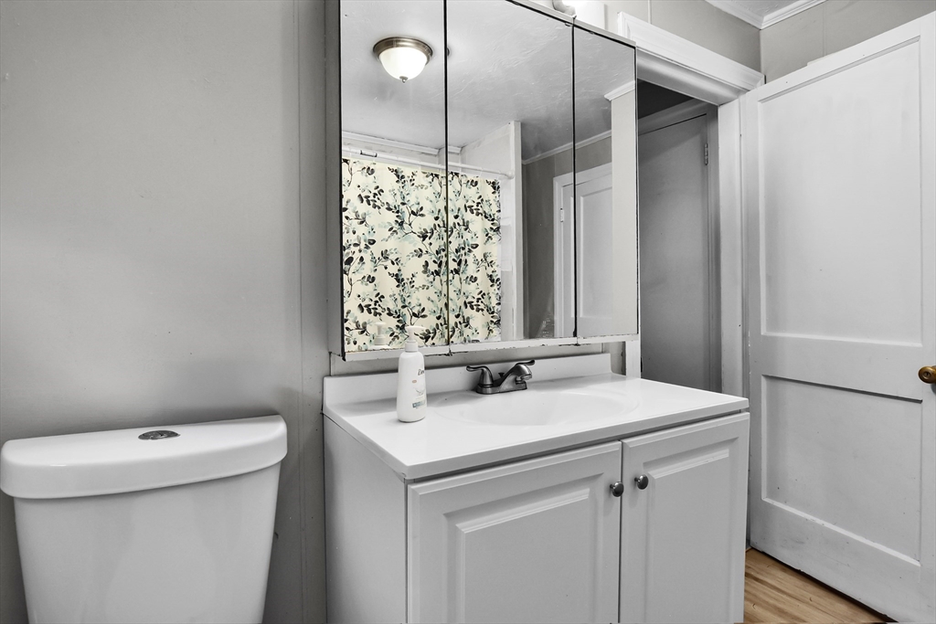 27-29 Allen Street Gardner, MA 01440 - Photo 9 of 30 a bathroom with a sink a toilet and shower