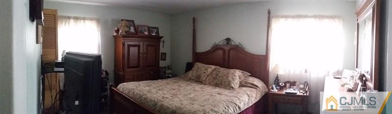10 Hansen Road Old Bridge, NJ 08857 - Photo 12 of 24 a bedroom with a bed and a mirror