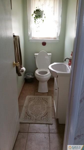 10 Hansen Road Old Bridge, NJ 08857 - Photo 17 of 24 a bathroom with a sink toilet and mirror