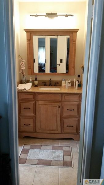 10 Hansen Road Old Bridge, NJ 08857 - Photo 21 of 24 a bathroom with a granite countertop sink vanity and mirror