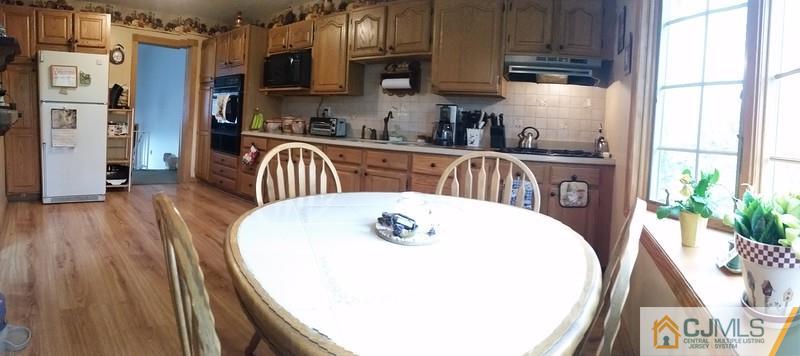 10 Hansen Road Old Bridge, NJ 08857 - Photo 4 of 24 a kitchen with stainless steel appliances a white cabinets and a granite counter tops