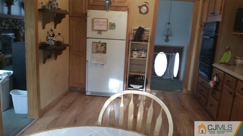 10 Hansen Road Old Bridge, NJ 08857 - Photo 6 of 24 a view of a livingroom with furniture and wooden floor
