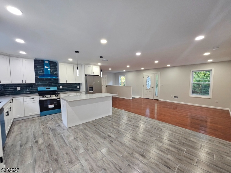 43 Rockport Road Wantage, NJ 07461 - Photo 12 of 30 a large kitchen with stainless steel appliances kitchen island a large counter top and a stove top oven