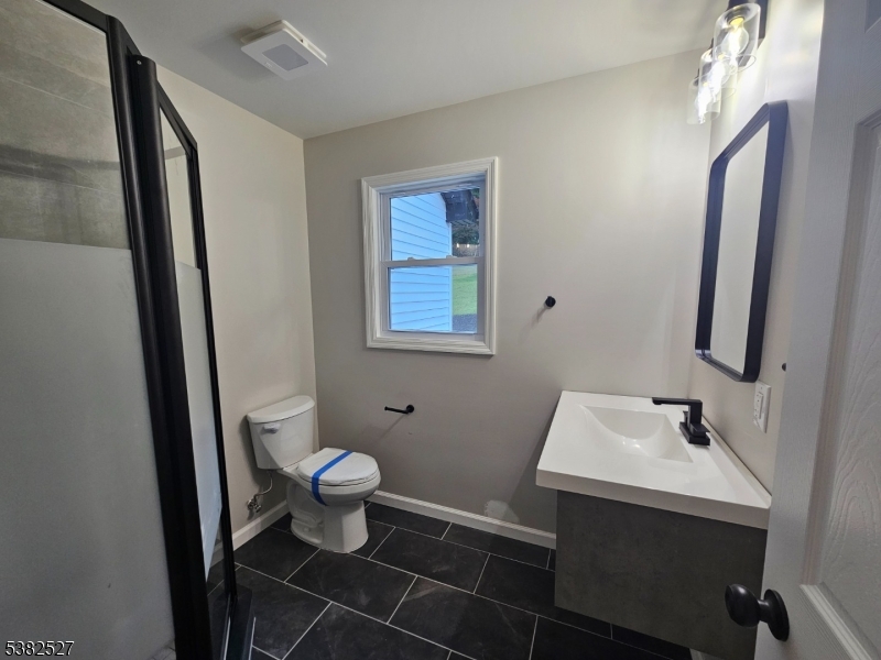 43 Rockport Road Wantage, NJ 07461 - Photo 21 of 30 a bathroom with a sink and a toilet