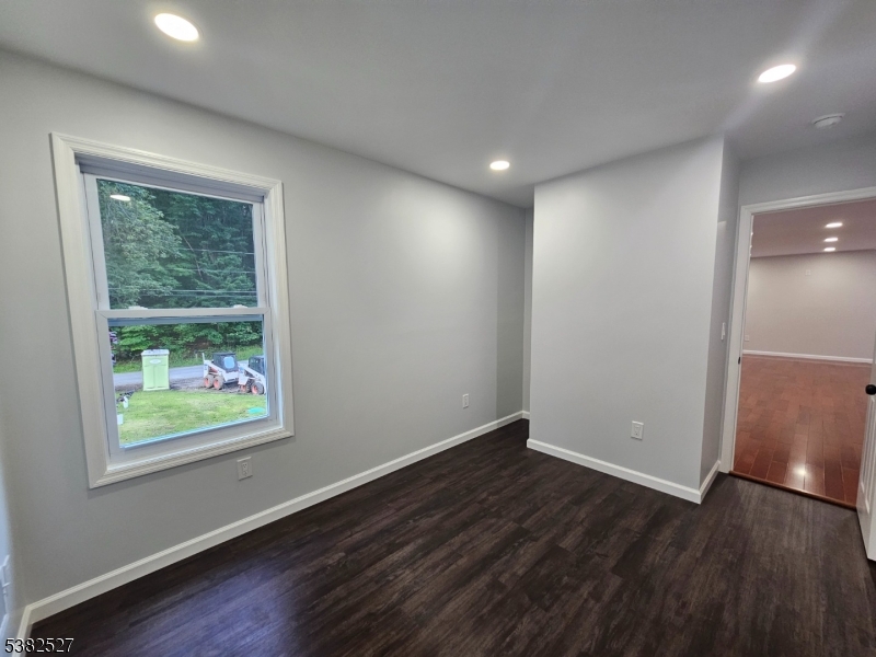 43 Rockport Road Wantage, NJ 07461 - Photo 28 of 30 an empty room with wooden floor and windows