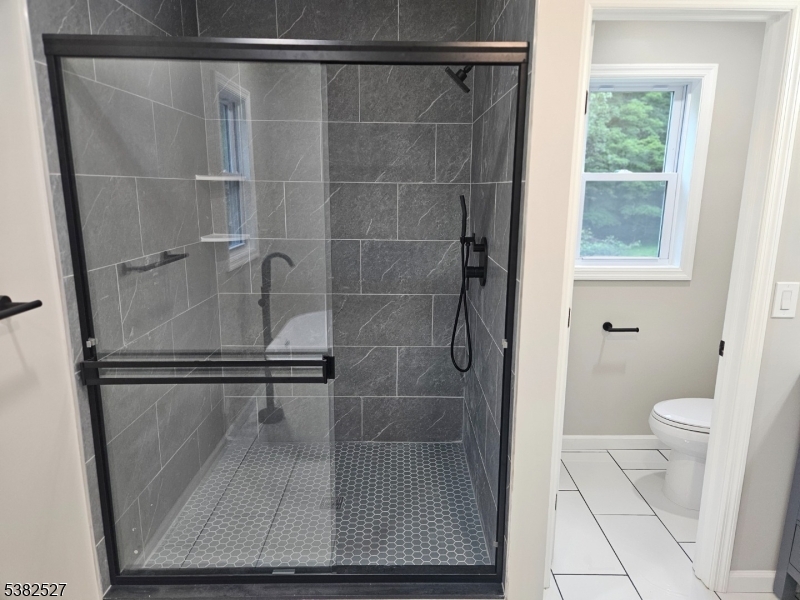 43 Rockport Road Wantage, NJ 07461 - Photo 4 of 30 a bathroom with a sink and a shower