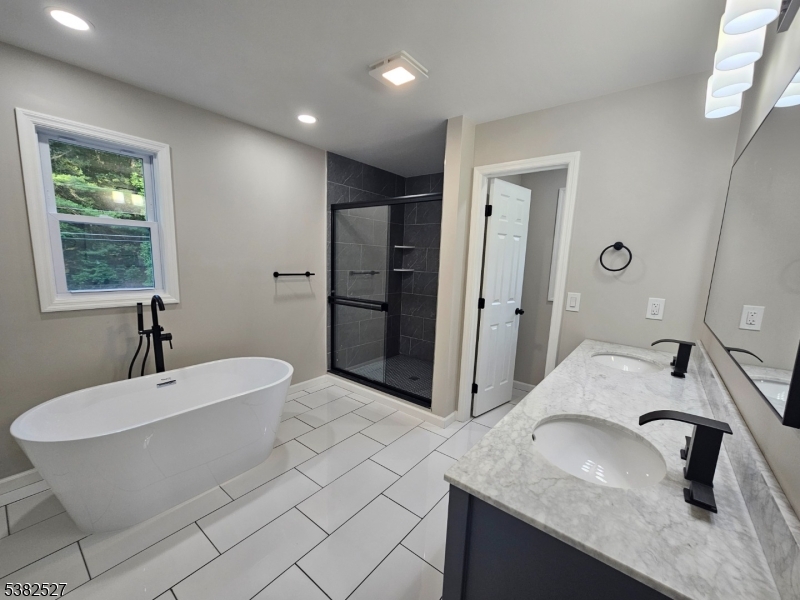 43 Rockport Road Wantage, NJ 07461 - Photo 8 of 30 a bathroom with a granite countertop sink and a mirror