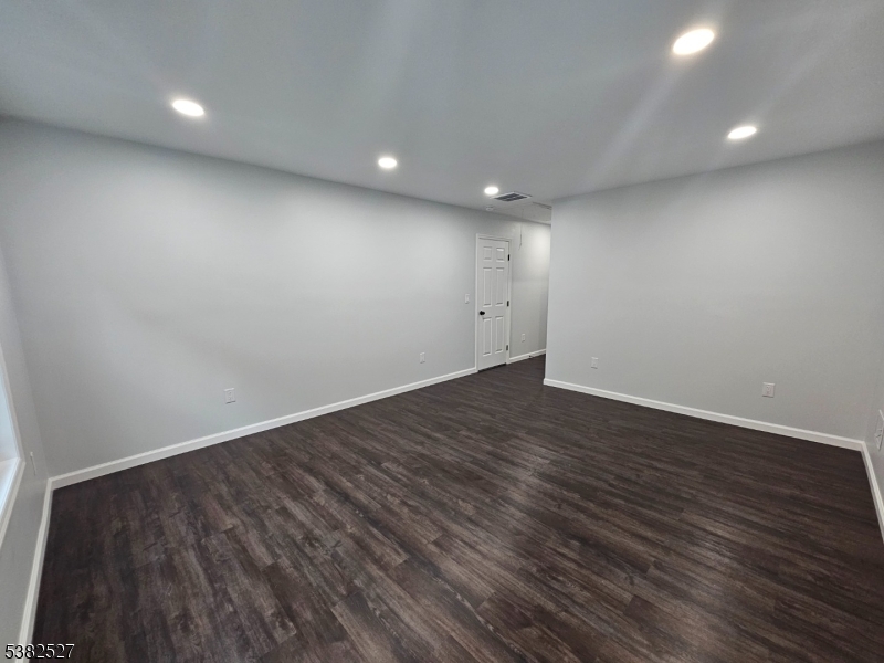 43 Rockport Road Wantage, NJ 07461 - Photo 10 of 30 an empty room with wooden floor and windows