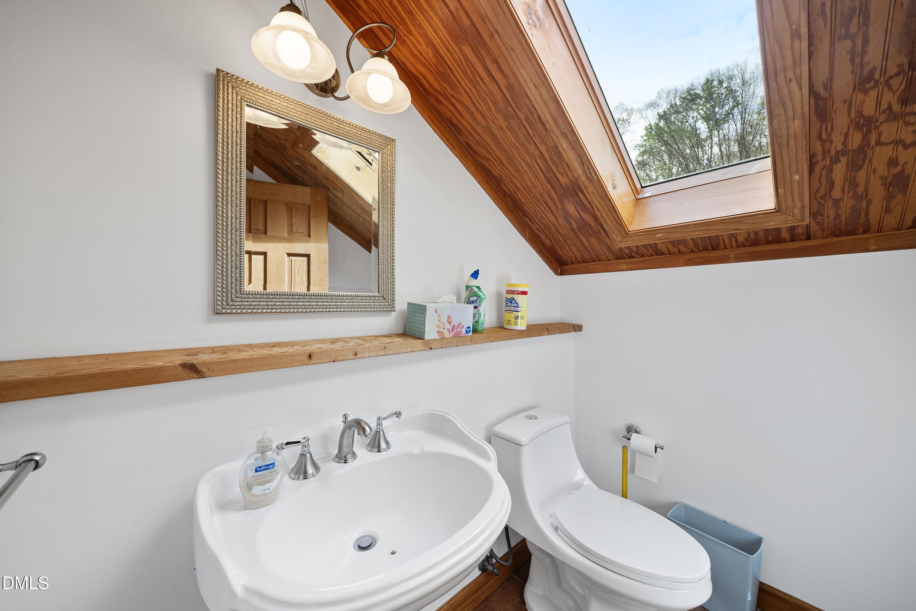 6200 Splitrock Trail Apex, NC 27539 - Photo 28 of 64 a bathroom with a toilet a sink and a window
