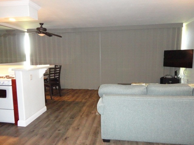 5050 Lawai Road, Unit 101 Koloa, HI 96756 - Photo 13 of 24 a bedroom with a bed and a flat screen tv