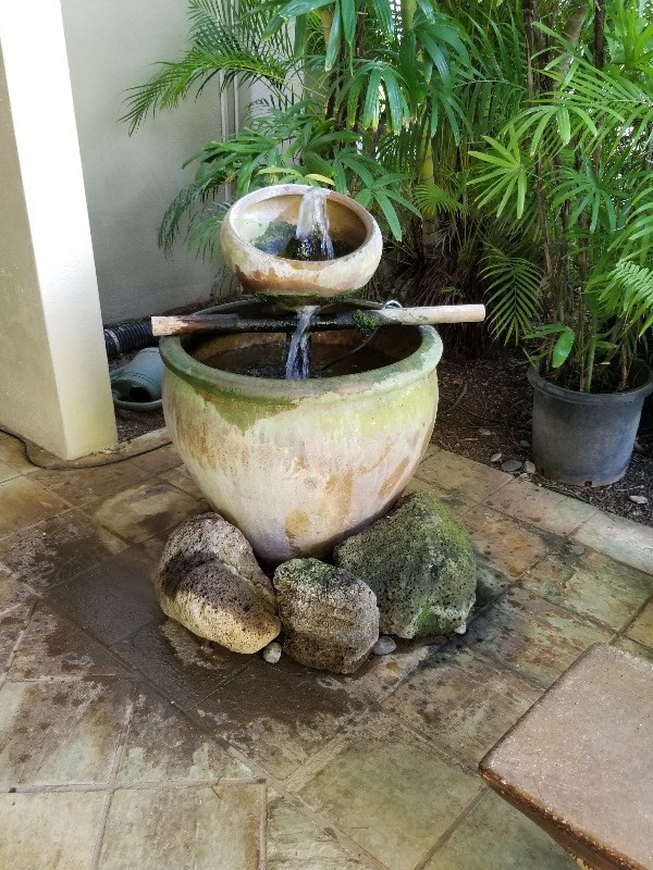 5050 Lawai Road, Unit 101 Koloa, HI 96756 - Photo 21 of 24 a view of a backyard with table and chairs