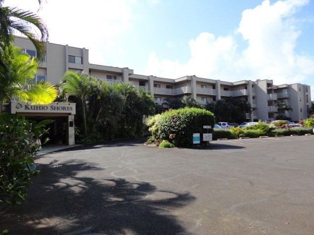 5050 Lawai Road, Unit 101 Koloa, HI 96756 - Photo 22 of 24 a view of a street with a building in front of it
