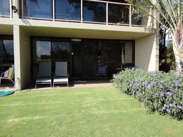 5050 Lawai Road, Unit 101 Koloa, HI 96756 - Photo 3 of 24 a view of a house with a porch and a large tree
