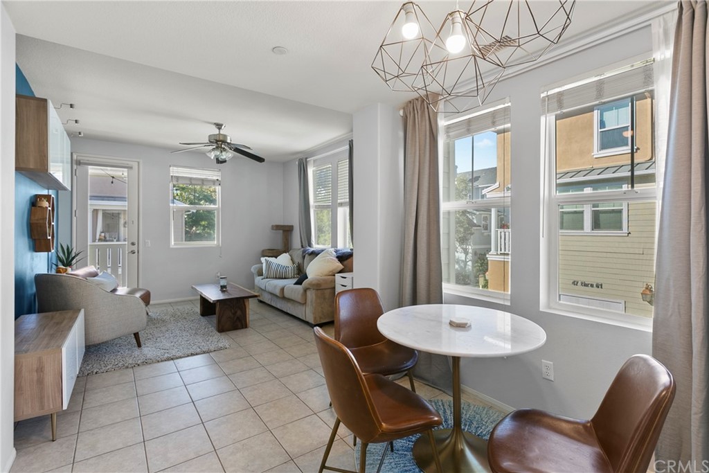 58 Valmont Way Ladera Ranch, CA 92694 - Photo 1 of 1 a living room with patio furniture and a chandelier