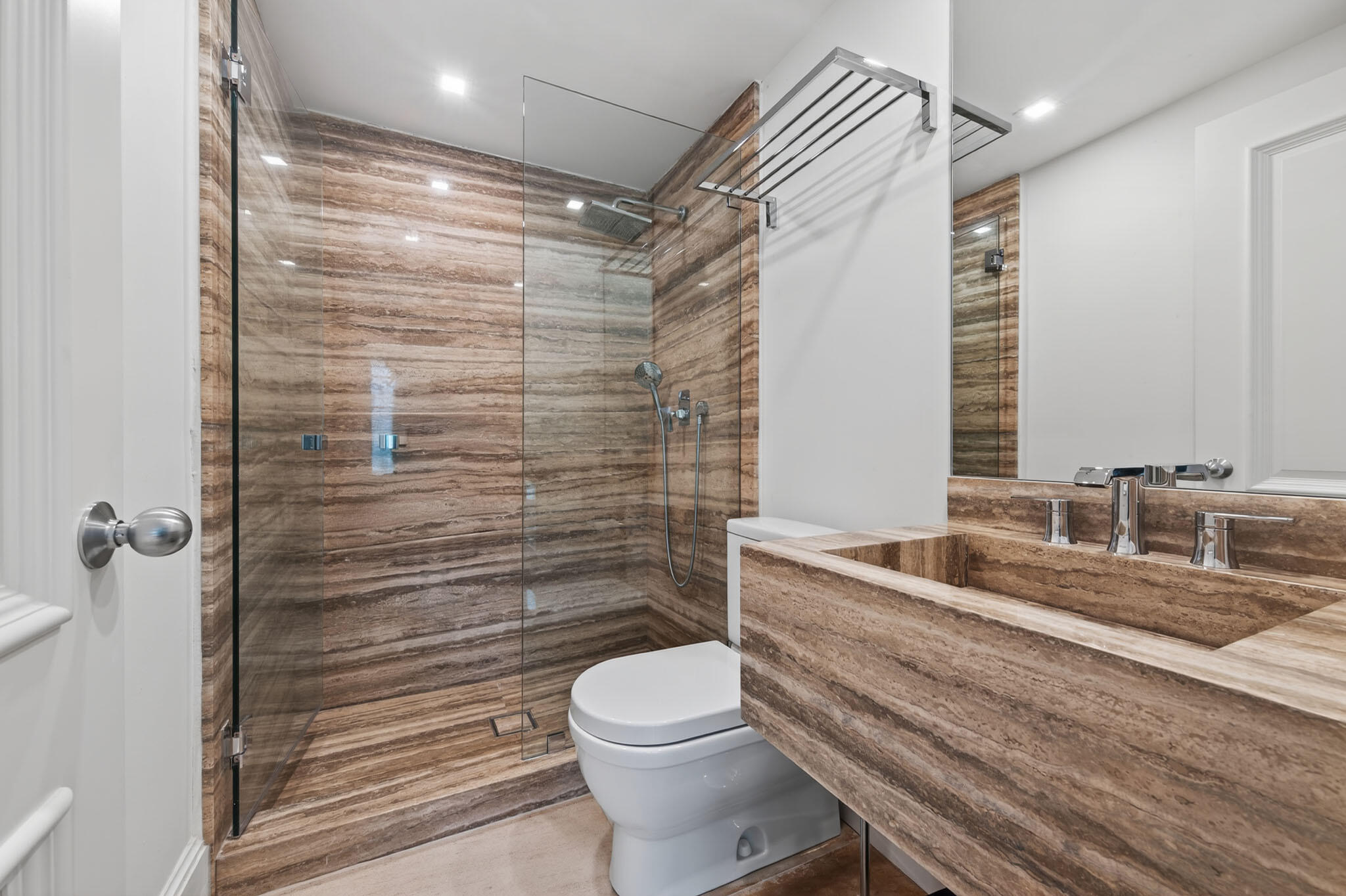 142 South County Road Palm Beach, FL 33480 - Photo 27 of 31 a bathroom with a granite countertop toilet sink and shower