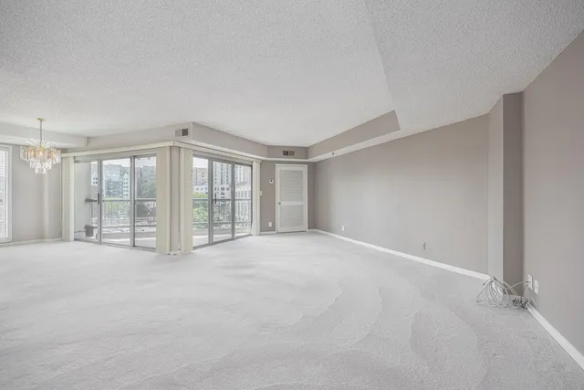 a view of an empty room with windows