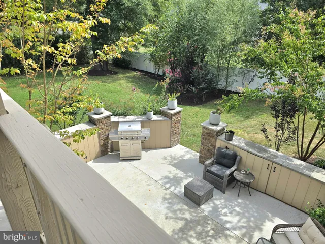 a bathroom with a tub a double vanity sink and mirror