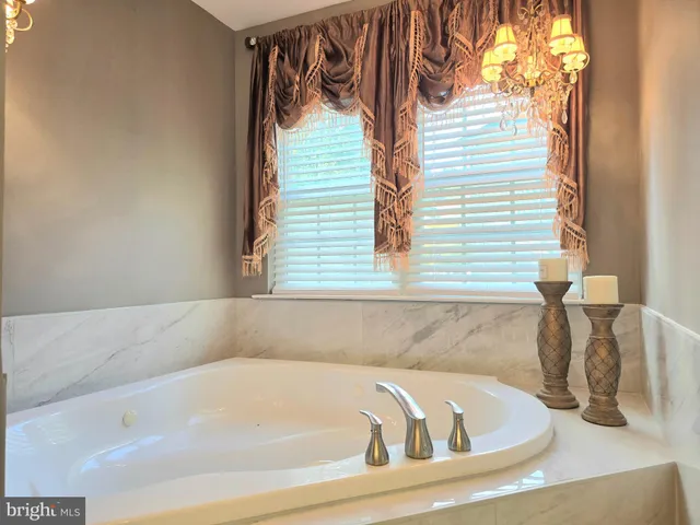 a white bath tub sitting in a bathroom