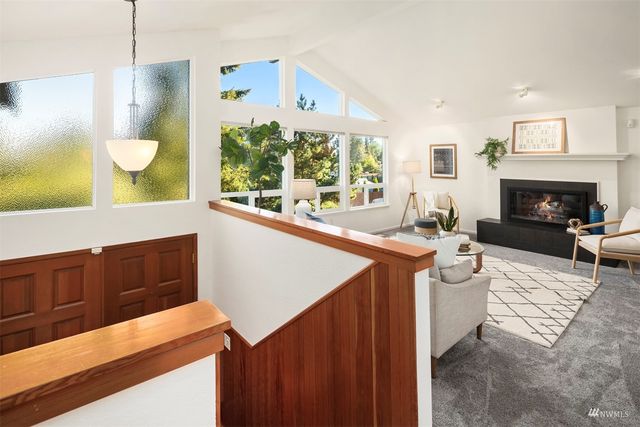 a kitchen with wooden cabinets stove and sink