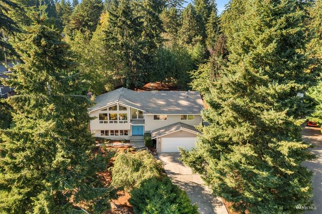 a aerial view of a house with a yard