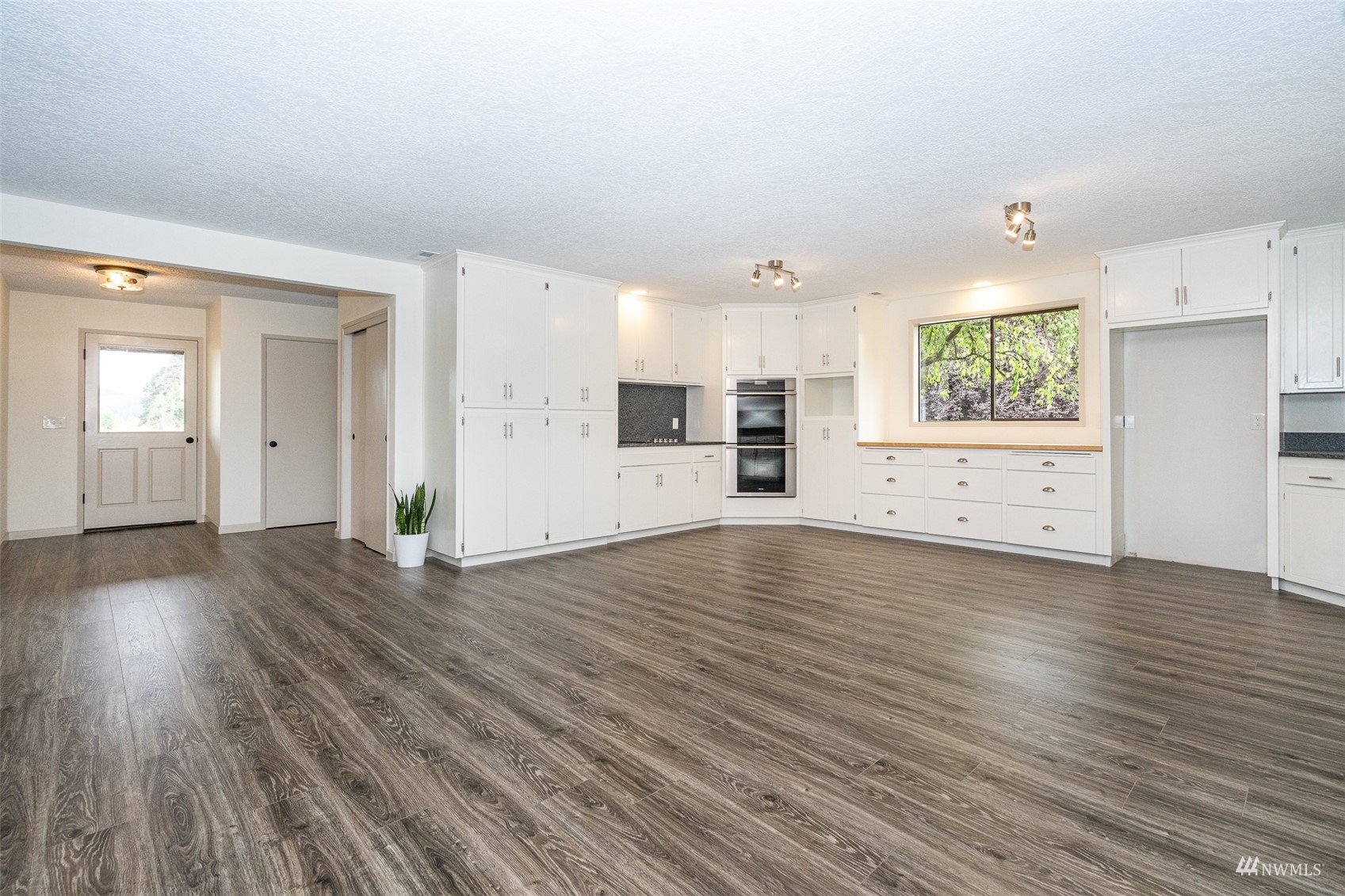 1861 Bishop Road Chehalis, WA 98532 - Photo 11 of 38 an empty room with wooden floor and windows