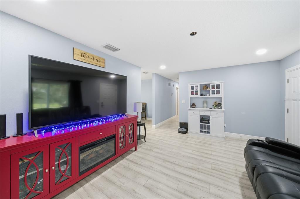 1113 Oakhill Street Seffner, FL 33584 - Photo 12 of 44 a living room with furniture and a flat screen tv