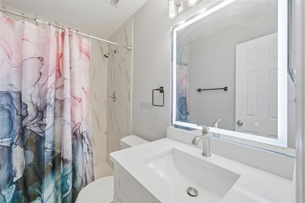 1113 Oakhill Street Seffner, FL 33584 - Photo 17 of 44 a bathroom with a sink and toilet