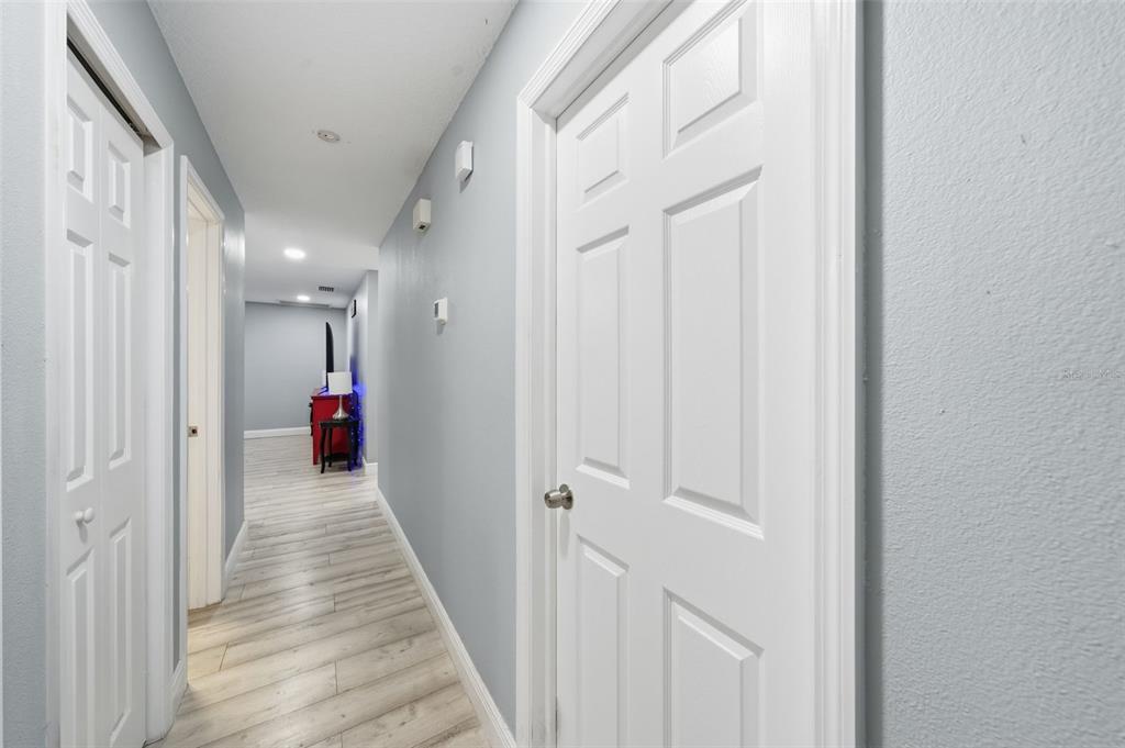1113 Oakhill Street Seffner, FL 33584 - Photo 19 of 44 a view of a hallway with a livingroom and a bathroom